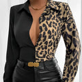 Leopard print belted shirt with deep v-neckline and long sleeves in black and tan spots on semi-sheer fabric