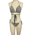 Black and white leopard print breathable strap bikini swimsuit with halter top and side-tie bottoms for summer beachwear