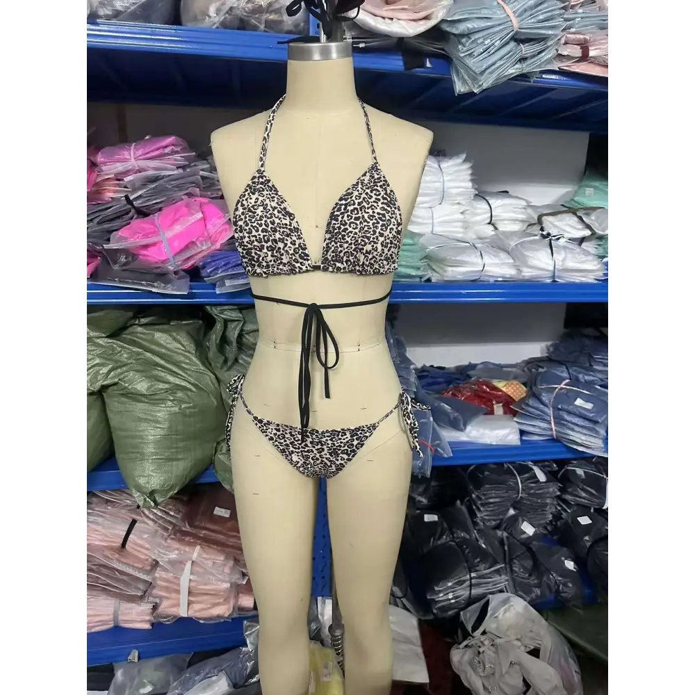 Leopard print breathable strap bikini swimsuit featuring a triangle top and matching bottoms with black waist ties