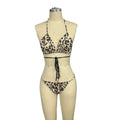 Leopard print breathable strap bikini swimsuit with triangle top, thin straps, and black tie waist bottoms