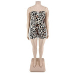 Strapless leopard print jumpsuit plus size with fitted bodice and shorts featuring black and tan spots on white base