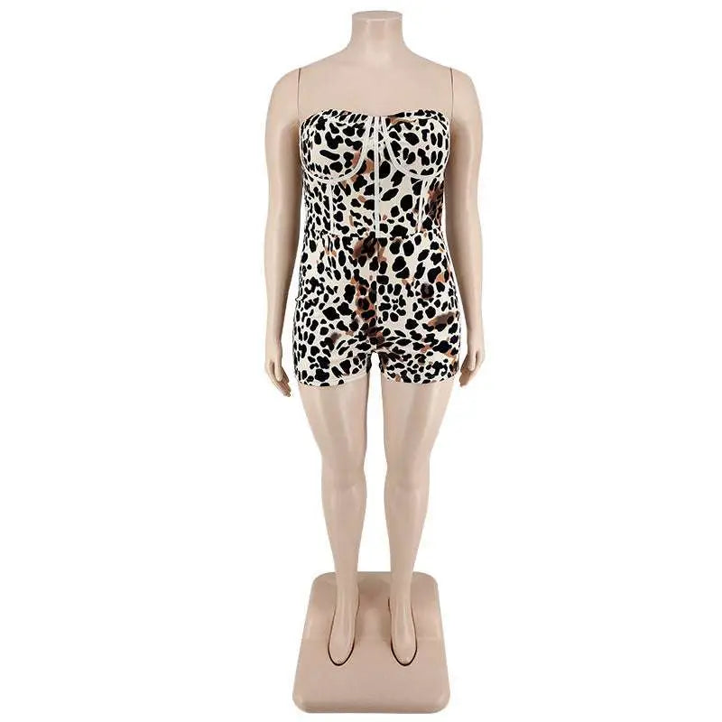 Strapless leopard print jumpsuit plus size with fitted bodice and shorts featuring black and tan spots on white base