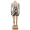 Strapless leopard print jumpsuit plus size with fitted corset waist and short legs on a white base made from stretchy fabric