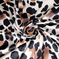 A soft flowing strapless leopard print jumpsuit plus size with bold black and tan pattern on a white base
