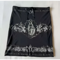 Black skirt with lace trim embroidery and central religious figure design featuring a drawstring waistband for a hot girl skirt