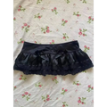 Black satin hot girl skirt with lace trim ruffles and bows for a leopard print sexy look
