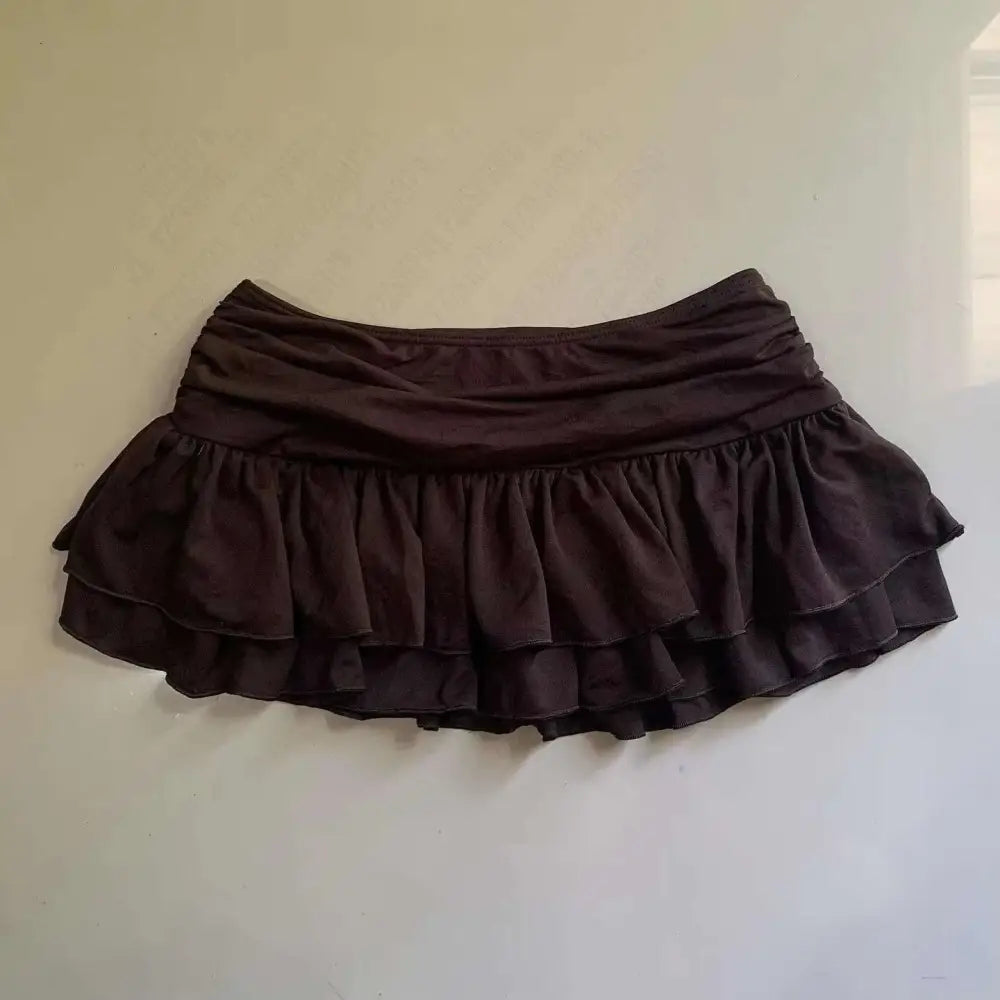 A dark brown two-tiered ruffle skirt with gathered waistband featuring lace trim in a leopard print sexy hot girl skirt style