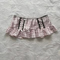 A pink polka-dot mini hot girl skirt with black lace trim lacing and ruffled hem leopard print sexy style