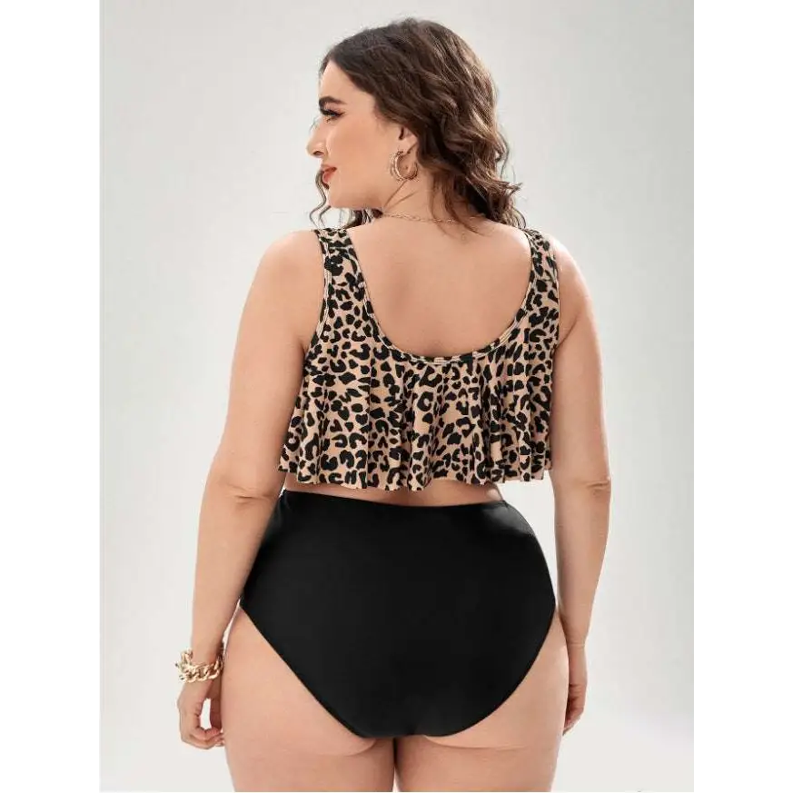 Leopard print swimsuit featuring a ruffled tankini crop top paired with high-waisted black swim bottoms