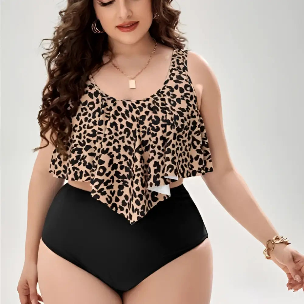 Leopard print swimsuit ruffled tankini with black and tan pattern paired with high-waisted black swim bottoms