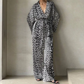 Leopard print two-piece black and white wraparound jumpsuit with wide sleeves and belted waist two-piece suit fashion