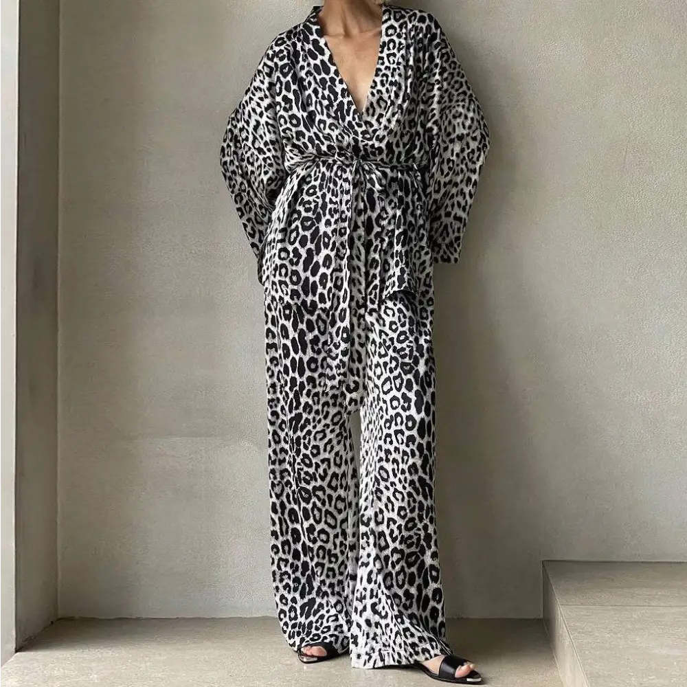 Leopard print two-piece black and white wraparound jumpsuit with wide sleeves and belted waist two-piece suit fashion