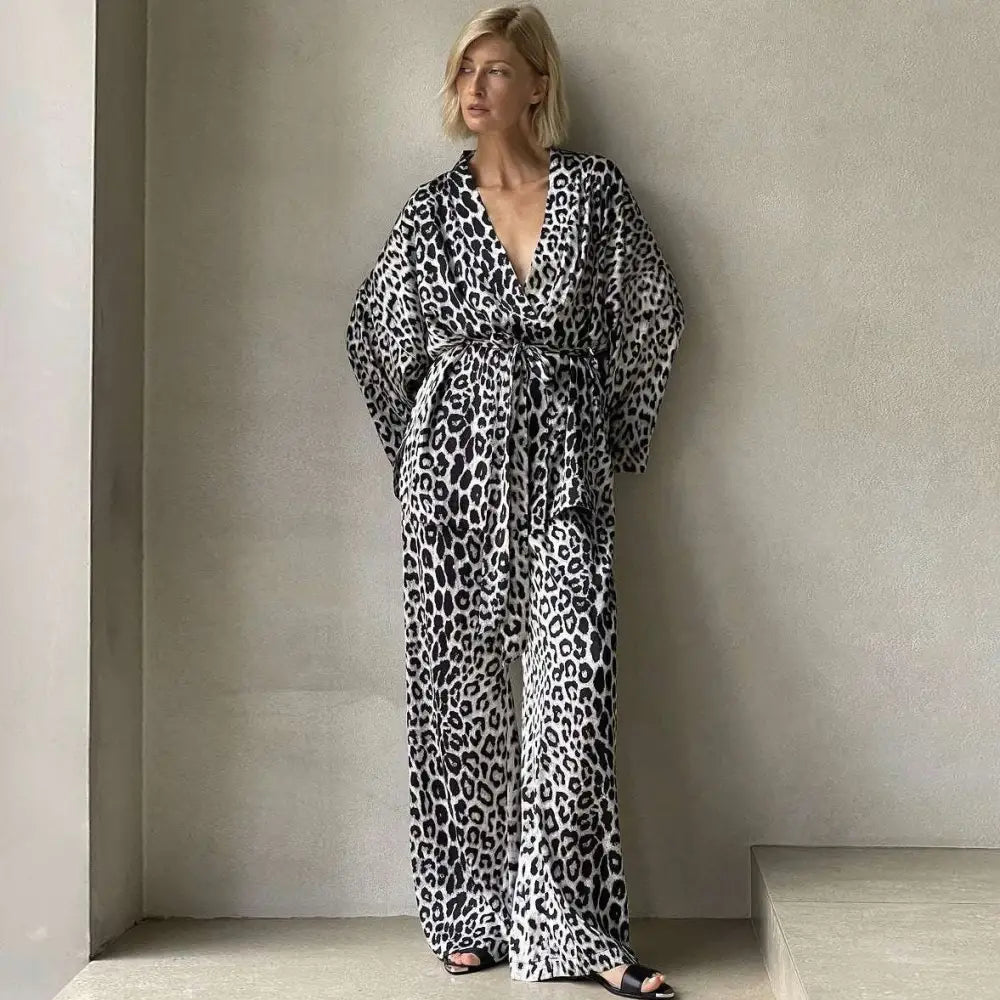 Black and white leopard print wraparound jumpsuit with wide sleeves and belted waist from leopard print two-piece suit fashion set