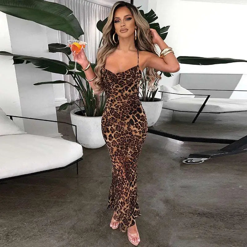 A fit long leopard printed lace dress with long sleeves, strapless neckline, and flared hem in slim fit long design