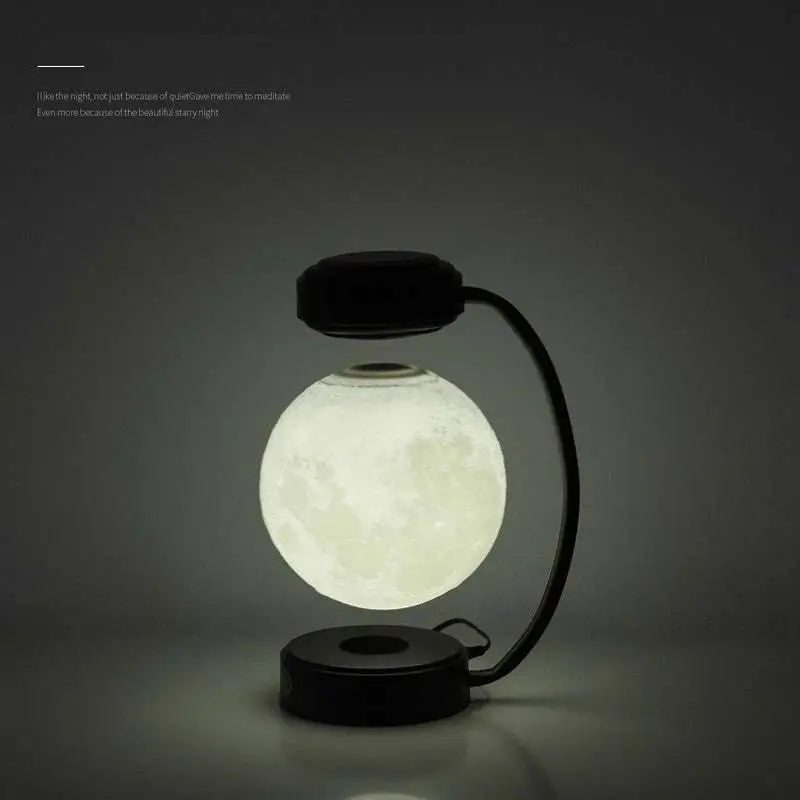 Levitating led moon night light with magnetic base and realistic lunar surface on black wireless night light stand
