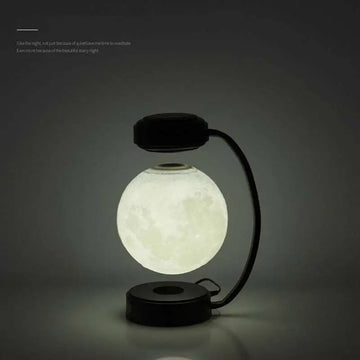 Levitating led moon night light with magnetic base and realistic lunar surface on black wireless night light stand
