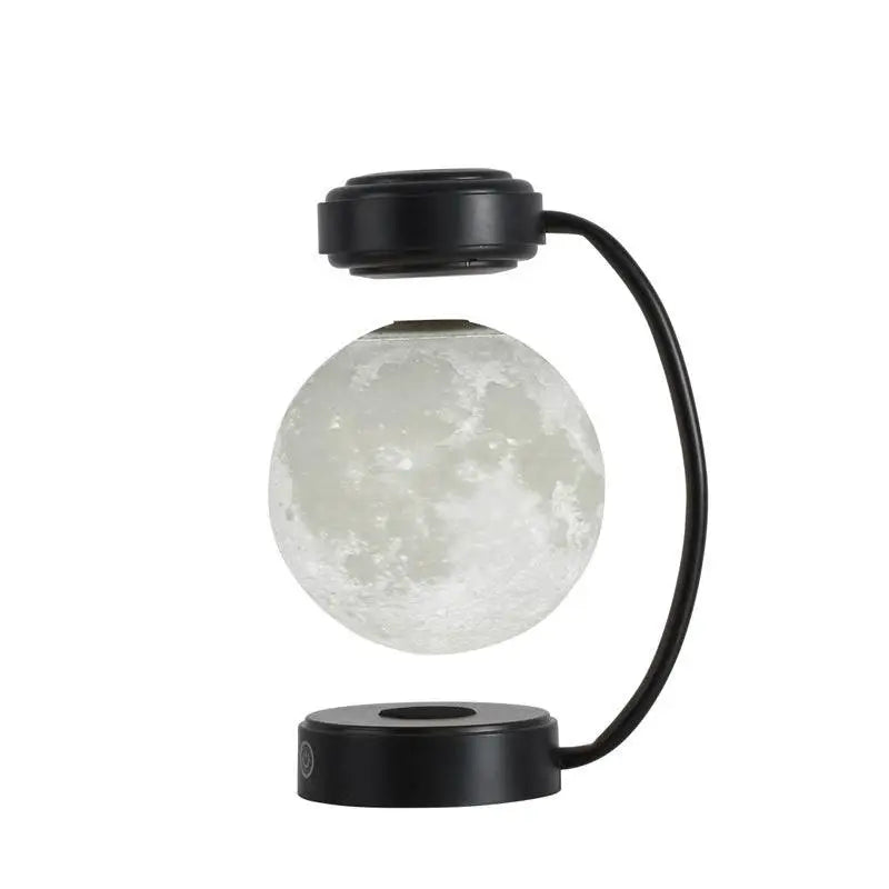 Levitating led moon night light with magnetic base and realistic lunar surface on black wireless night light stand