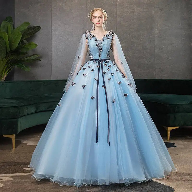 Light blue tulle ball gown with black floral appliqués and sheer cape for vocal choral art exam performances
