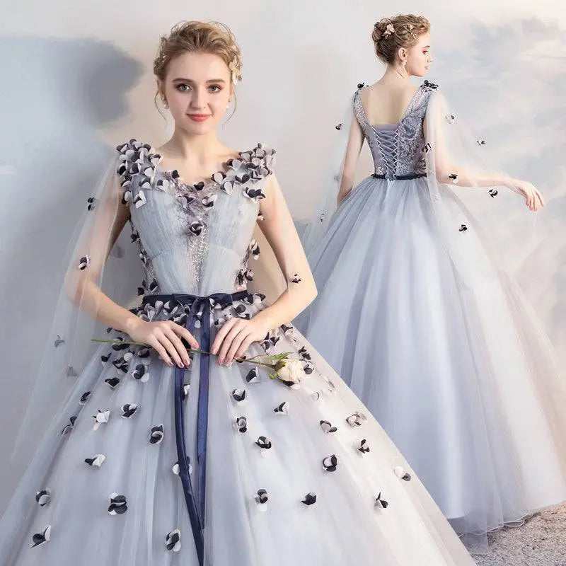 Light blue tulle gown with black and white floral appliqués lace-up back navy sash for vocal choral art exam performances