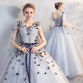 Light blue tulle gown with black and white floral appliqués lace-up back navy sash for vocal choral art exam performances