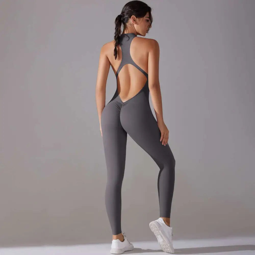 A sleek gray long pants jumpsuit with high neckline and open back design for jumpsuit yoga fitness slim bodysuit use