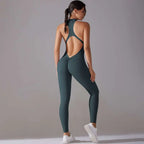 A sleek dark teal slim bodysuit one-piece long pants jumpsuit yoga fitness wear with high neckline and open back design