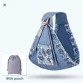 Light blue mesh newborn sling with wooden ring featuring blue floral pattern and matching drawstring pouch for nursing cover