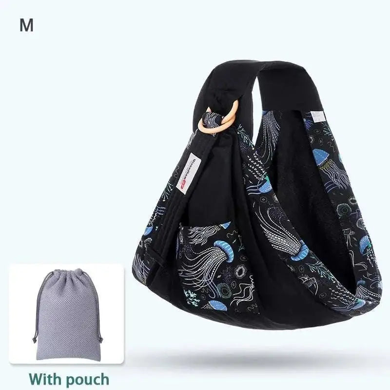 Light blue mesh newborn sling with wooden ring featuring black fabric and blue white jellyfish nursing cover pattern