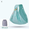 Light blue mesh newborn sling with wooden ring featuring soft mint green fabric and adjustable straps for nursing cover