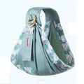 Soft sage green newborn sling with teal and gray leaf pattern and wooden ring for nursing cover use
