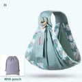 Light blue mesh newborn sling with wooden ring featuring sage green leaf pattern and matching drawstring pouch nursing cover