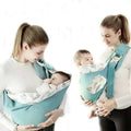 Light blue mesh newborn sling with wooden ring and adjustable straps in teal and white leaf pattern for nursing cover use