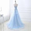 Light blue slim fit bridesmaid gown with corseted bodice silver beading and delicate tulle lace detailing