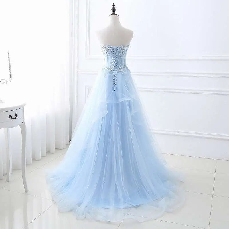 Light blue slim fit bridesmaid gown with corseted bodice silver beading and delicate tulle lace detailing