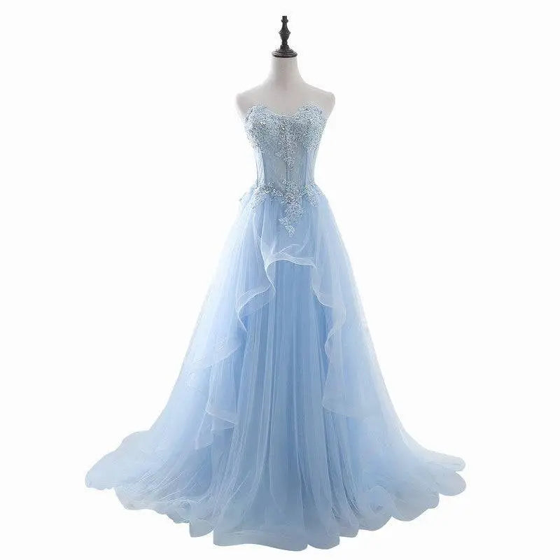Light blue slim fit bridesmaid gown with silver beading crafted from layered tulle for an ethereal silhouette