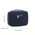 Black fabric travel storage bag with subtle white logo designed as a square travel storage and light blue multifunctional bag
