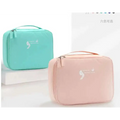 Pastel pink and teal soft fabric square travel storage bag with subtle white logo for light blue multifunctional use