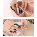 Pink fabric makeup organizer with divided compartments and clear plastic brush sleeve in light blue multifunctional travel storage bag