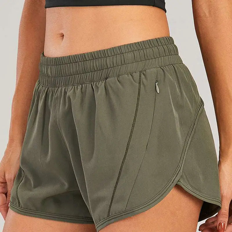 Light blue summer sports shorts with zipper pockets and elastic waistband for breathable comfort and secure storage