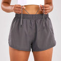 Light blue breathable summer sports shorts with elastic waistband and zipper pockets for secure storage