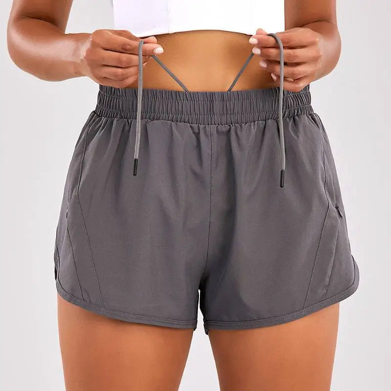 Light blue breathable summer sports shorts with elastic waistband and zipper pockets for secure storage