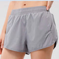 Light blue summer sports shorts with elastic waistband and breathable fabric featuring zipper pockets for secure storage