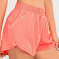 Coral pink summer sports shorts with elastic waistband breathable fabric and zipper pockets for secure storage