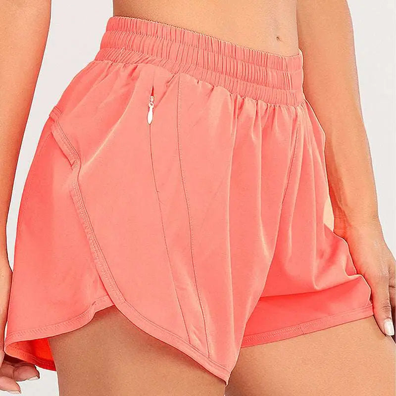 Coral pink summer sports shorts with elastic waistband breathable fabric and zipper pockets for secure storage
