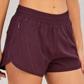 Purple summer sports shorts with elastic waistband breathable fabric and subtle pink zipper pockets accents
