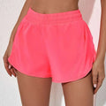 Bright pink summer sports shorts with elastic waistband and breathable zipper pockets for active use