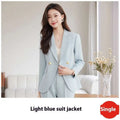 Light blue tailored business suit jacket with gold buttons featuring a slim fit for formal occasions