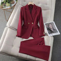 A tailored business suit featuring a sleek wine red blazer with gold buttons and matching trousers for formal wear