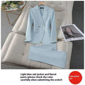 Light blue tailored business suit with gold buttons featuring a blazer and matching flared pants for formal wear