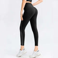Black seamless high waisted leggings with sleek side panels designed as butt lifting workout leggings